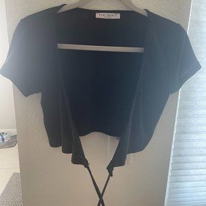 Blue Blush Boutique short sleeve wrap around tie top in slightly sheer black